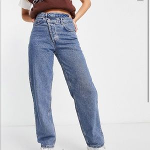 Asymmetrical criss cross zip jeans